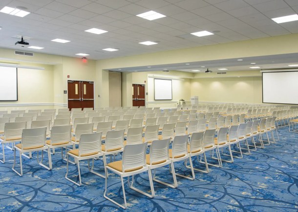 CSU event space Whitfield Center Drew Conference Room with chairs and projection screens setup.